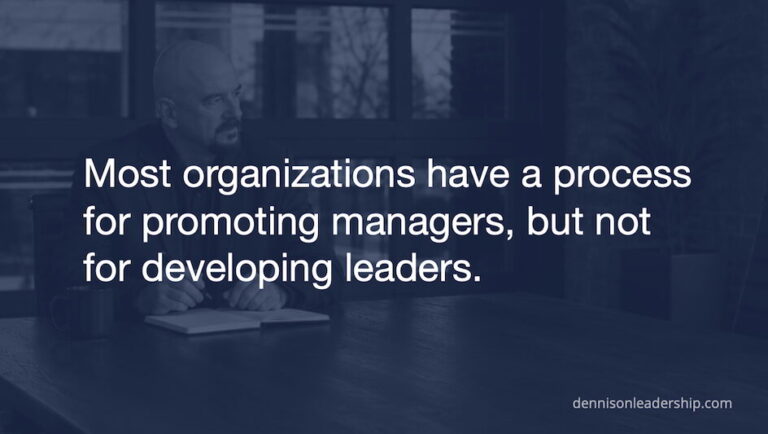 Mike Dennison writing at a desk, with text reading 'Most organizations have a process for promoting managers, but not for developing leaders.